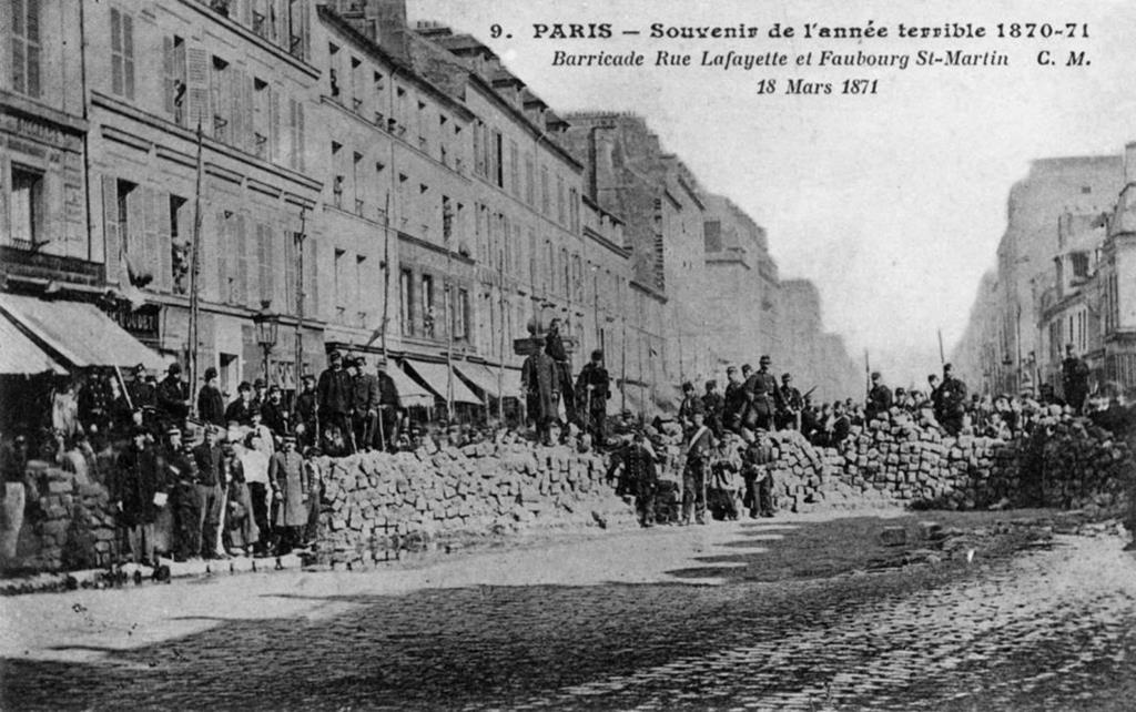 A black and white photo of The Paris Commune barricade in 1871.